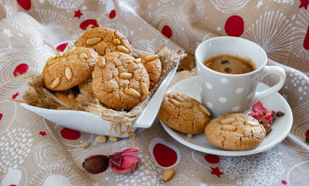 Delicate butter biscuits with crunchy fresh pine nutsの写真素材