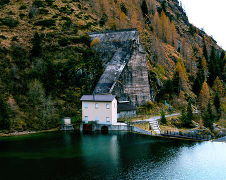 mountain landscape in the alps with the historic dam of the glenoの写真素材
