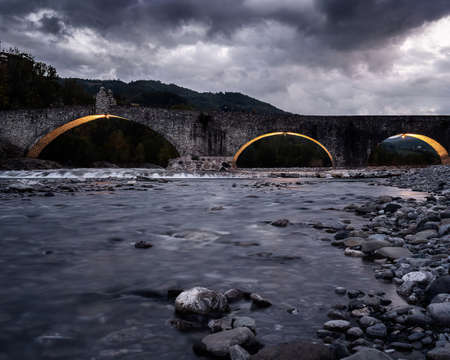 beautiful historic and ancient bridge of a small Italian town in medieval styleの写真素材