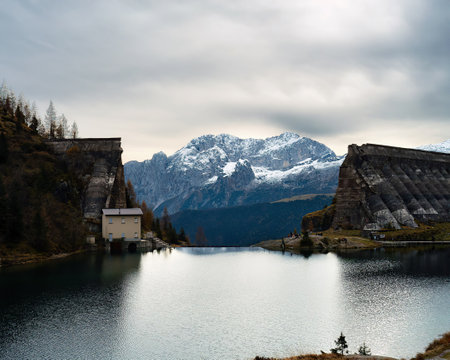 mountain landscape in the alps with the historic dam of the glenoの写真素材
