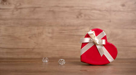 Gift box on the wooden background. Valentine's Day gift. Red box.の写真素材