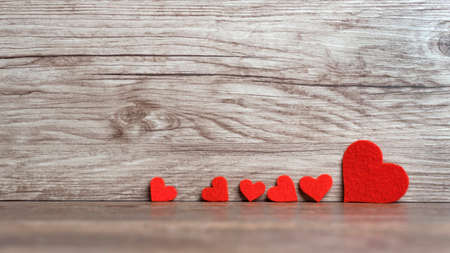 valentines day background with two hearts on wooden backgroundの写真素材