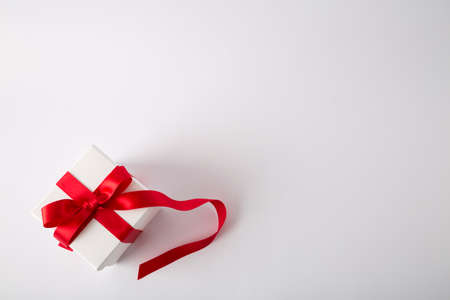 Gift box on the white background. Red ribbon. Valentines Day gift. Isolatedの写真素材