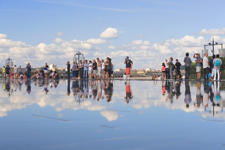 Bordeaux, France - 4 August, 2015 : Bordeaux water mirror full of people in one hottest summer days,...