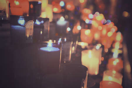 Colorful abstract candles light background in a church, vintage styleの素材