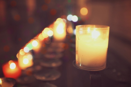 Colorful abstract candles light background in a church, vintage styleの素材