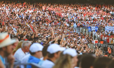 Blurred crowd of spectators on stadium at a sporting eventのeditorial素材