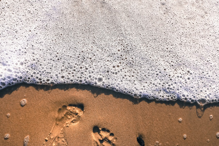 Footprints on the sand beachの写真素材