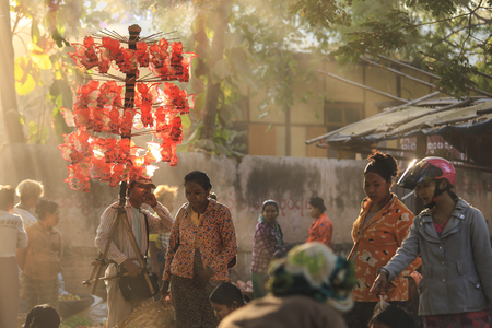 BAGAN, MYANMAR - Fabruary 3, 2017 :  Morning market at Yong U Market with sun ray, this is local market selling rice, fish, vegetables, flower, clothes and souvenirs, grain texture styleのeditorial素材