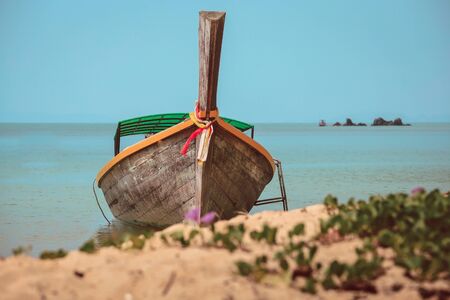 Long tail boat on tropical island in Thailand