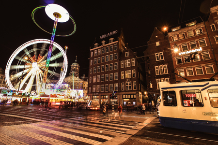Amsterdam-Netherlands, April 16, 2017 : Amsterdam street at night with long exposure ferris wheelのeditorial素材