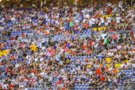 Blurred crowd of spectators on stadium at a sporting eventの写真素材