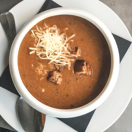 Bowl of french fish soup Bouillabaisse with cheese and Croutonの写真素材