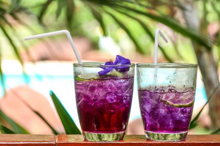 Butterfly pea juice with lemon in cold glass, Thai herb drink for healthの写真素材