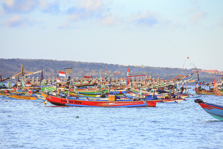 BALI, INDONESIA - AUGUST 3, 2017 : Colorful handcrafted Balinese wooden fishing boat at port in Jimbaran beach, Baliのeditorial素材