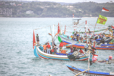 BALI, INDONESIA - AUGUST 3, 2017 : Colorful handcrafted Balinese wooden fishing boat at port in Jimbaran beach, Baliのeditorial素材