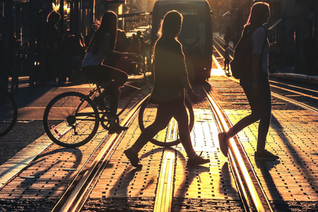 BORDEAUX, FRANCE - 23 September, 2017 : Blurred of people riding bicycle and walking on street during the sunset in the city of Bordeaux in vintage style and grain textureのeditorial素材