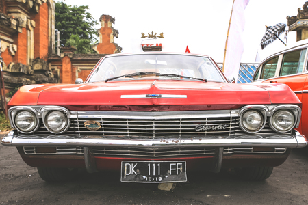 BALI, INDONESIA - AUGUST 6, 2017 : Retro red Chevrolet car displayed at the vintage car fair in Bali, Indonesiaのeditorial素材