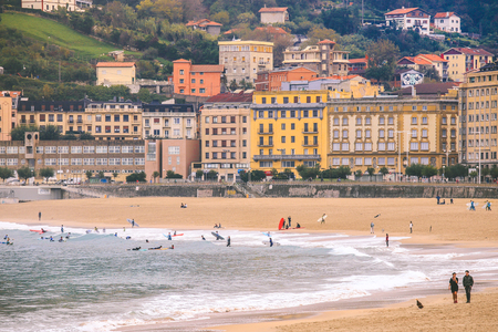 San Sebastian Spain - October 26 2017: People enjoy their vacation on the beach at the La Concha beach in the city of San Sebastian Basque country Spainのeditorial素材