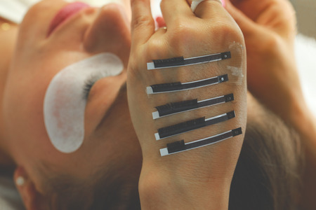 Selcetive focus on false lashes for eyelash extension procedure. Beauty and fashion concept.の写真素材