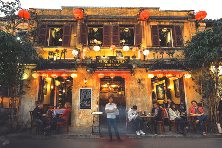 Hoi An, Vietnam - February 9, 2018 : Restaurants and shops on the banks of the Thu Bon river in Hoi An at night.のeditorial素材