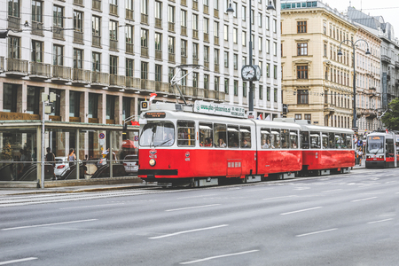 Vienna, Austria- May 27, 2018 : Old fashioned tram  passing by Maria Theresa Monument in Vienna downtownのeditorial素材