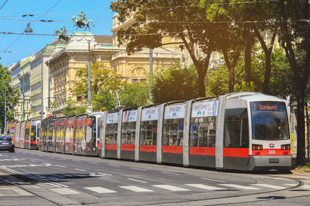 Vienna, Austria- May 27, 2018 : Old fashioned tram  passing by Maria Theresa Monument in Vienna downtownのeditorial素材