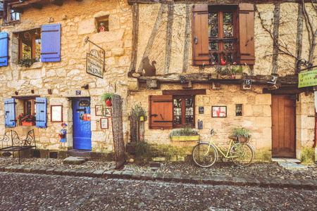 Bergerac - France, 21 JULY , 2018 : Facade of stone houses with wooden doors and blue windows in Bergerac town, Franceのeditorial素材