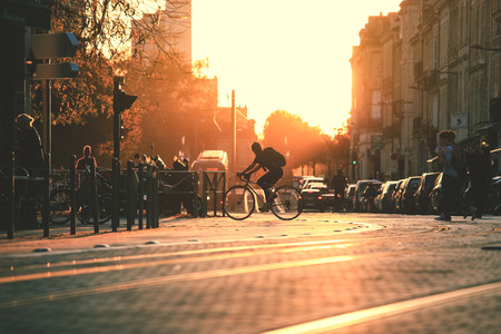 BORDEAUX, FRANCE- October 1, 2018 : City street scene, selective focus on people walking on street with tramway during the sunset in Bordeaux, Franceのeditorial素材