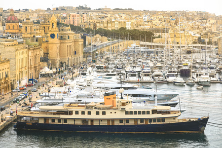 Valletta Malta - April 1 2018 : The Valletta port is a popular tourist attraction full of cafes and restaurants.のeditorial素材