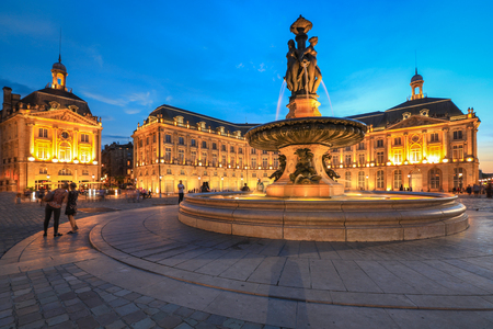 Selective focus on building, People enjoy visiting Place de la Bourse at twilight, Place de la Bourse is one of the most recognizable sights of Bordeaux, Franceのeditorial素材