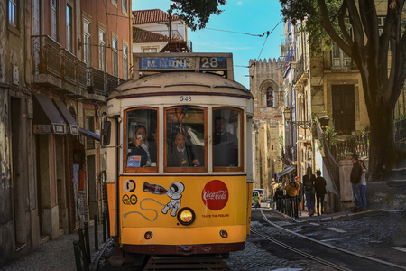 LISBON - PORTUGAL, November 5, 2018: An old traditional tram carriage in the city centre of Lisbon, Portugal. The city kept old traditional tram in service within the historical part of the capitalのeditorial素材