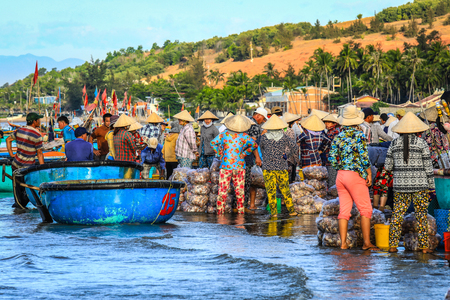 Mui ne Vietnam January 22, 2019 : Early morning fishing village in Mui ne, full of Vietnamese vendor on the beachのeditorial素材