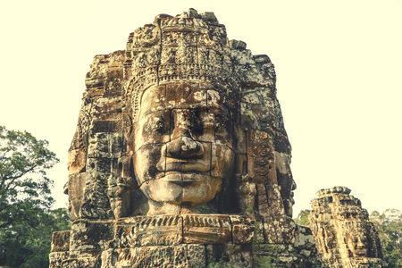 Smiling Faces of Bayon temple in Angkor Thom ancient ruin near Angkor Wat, Siem Reap, Cambodiaの写真素材