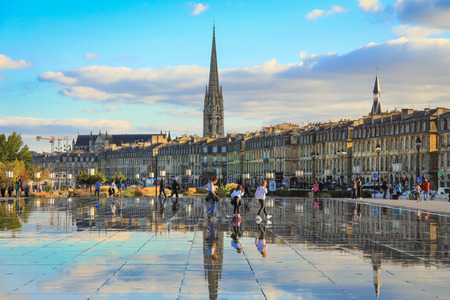 Bordeaux, France - 17 October, 2018 : Bordeaux water mirror full of people in one of the hotest summer day, having fun in the water, the pool is the largest water mirror in the world with 3450 sq.m.のeditorial素材