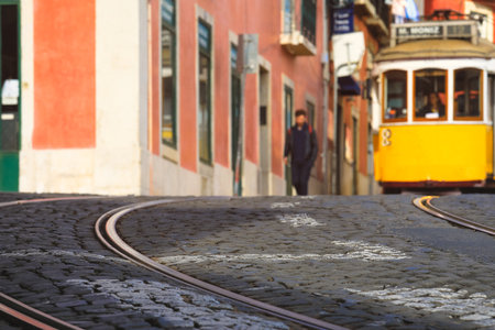 Selective focus on floor with blurred image of Street in the old district of the city, Lisbon, Portugalの写真素材