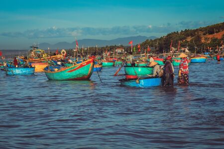 Mui ne Vietnam January 22, 2019 : Early morning fishing village in Mui ne, full of Vietnamese fishermen on the beachのeditorial素材