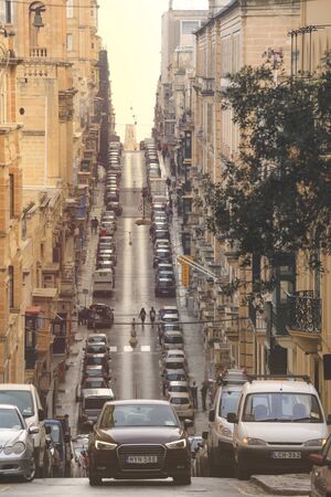 VALLETTA MALTA - APRIL, 21 2018: Old street with traditional houses in the city center of Valletta Maltaのeditorial素材