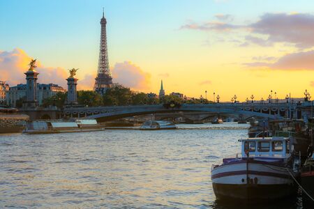 Eiffel Tower and Alexandre III Bridge at sunsetの写真素材