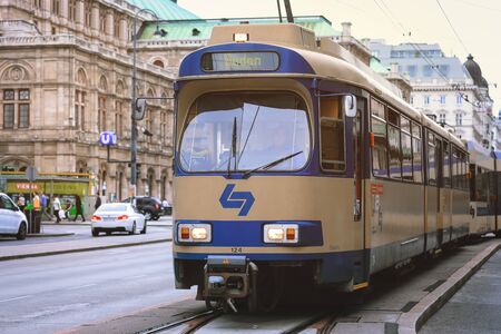Public transportation tram near Vienna State Opera at the city center of Austria's capital city Vienna.のeditorial素材