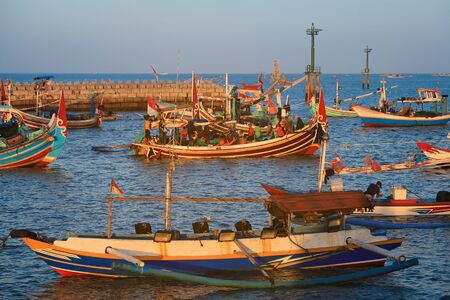 BALI, INDONESIA - AUGUST 3, 2017 : Colorful handcrafted Balinese wooden fishing boat at port in Jimbaran beach, Baliのeditorial素材