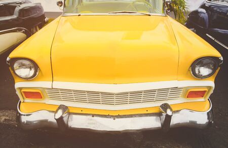 close up front yellow retro car parking outsideのeditorial素材