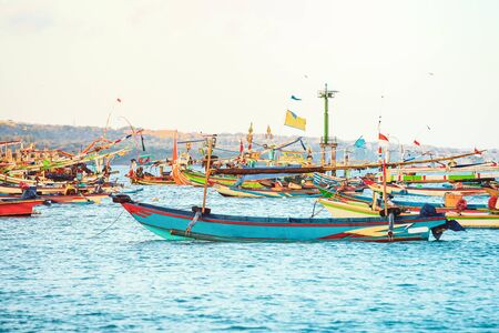 Colourful handcrafted Balinese wooden fishing boat at port in Jimbaran beach, Baliの写真素材