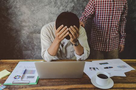 Man encouragement his depressive friend tried from over work.   business problem, financial and investment conceptの写真素材
