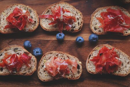 Selective foucs on ham jamon Bellota  on wooden boardの写真素材