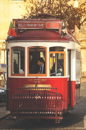 Lisbon- Portugal, December 23, 2018: An old traditional tram carriage in the city centre of Lisbon, Portrgal. The city kept old traditional tram in service within the historical part of the capitalのeditorial素材