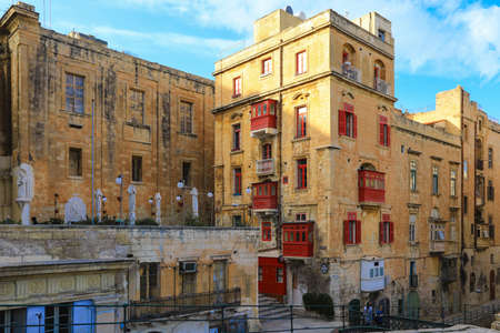 View of traditional Maltese street with shutters and balconies in Valletta, Capital city of Maltaのeditorial素材