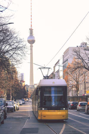 Yellow  public transportation tram passing by the city of Berlin Germanyのeditorial素材