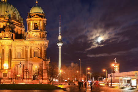 Street view of St. Mary Church and TV Tower at night in Berlin, Germany.のeditorial素材