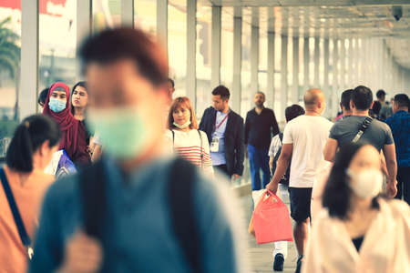 Bangkok - Thailand, February 27, 2020 :  Selective focus on people wearing protection face mask against Coronavirus flu virusのeditorial素材